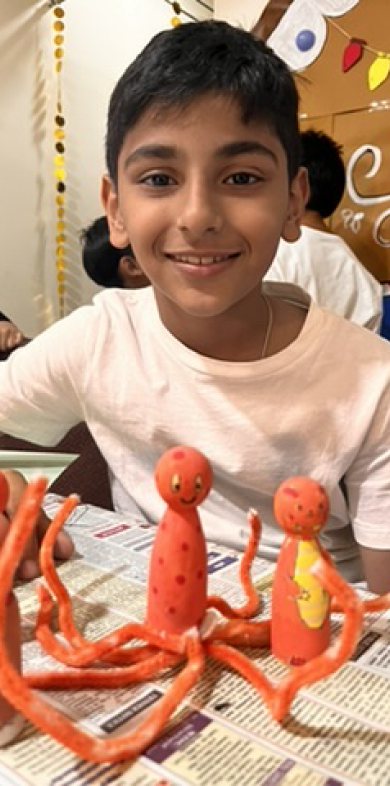 Children at Owtofbox workshops — building, painting and investigating together