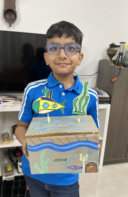 Children at Owtofbox workshops — building, painting and investigating together